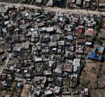 Haiti takes refuge in mass graves