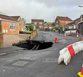 Giant Sinkhole Shocks Quiet Residential Area in Merthyr Tydfil, Wales