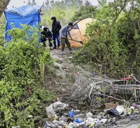 Man confesses to killing five people at and near migrant camp in northern France