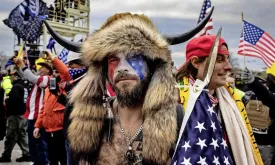 QAnon Shaman Celebrates New Guns After Trump's Pardon: 'I Love This Country'