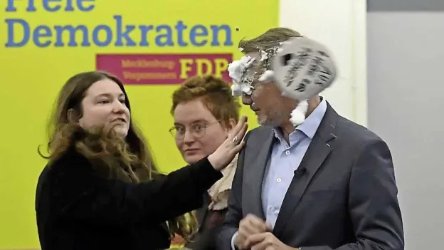 German Former Minister Attacked with Shaving Foam by Woman During Campaign Event