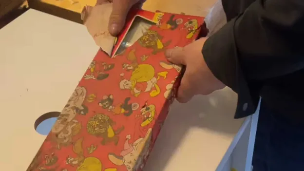 Man Finds Wrapped Christmas Gift from 46 Years Ago During Renovation of Parental Home