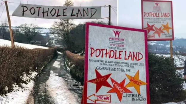 Residents of Welsh village fed up with road potholes turn them into amusement park